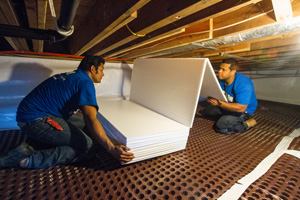Installing TerraBlock™ insulation on a crawl space floor